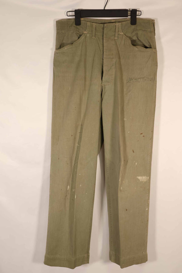 Real 1940s U.S. Marine Corps USMC M42 HBT utility pants, faded, stained.