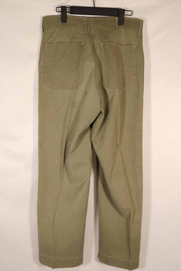 Real 1940s U.S. Marine Corps USMC M42 HBT utility pants, faded, stained.
