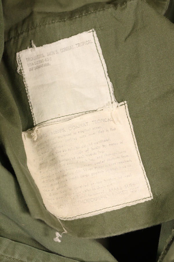 สัญญาปี 1963 – คาดว่าเป็นกางเกงทหารแบบ Jungle Fatigue รุ่นที่ 1 ของ M-S – มีสีจางบางส่วน – มือสอง