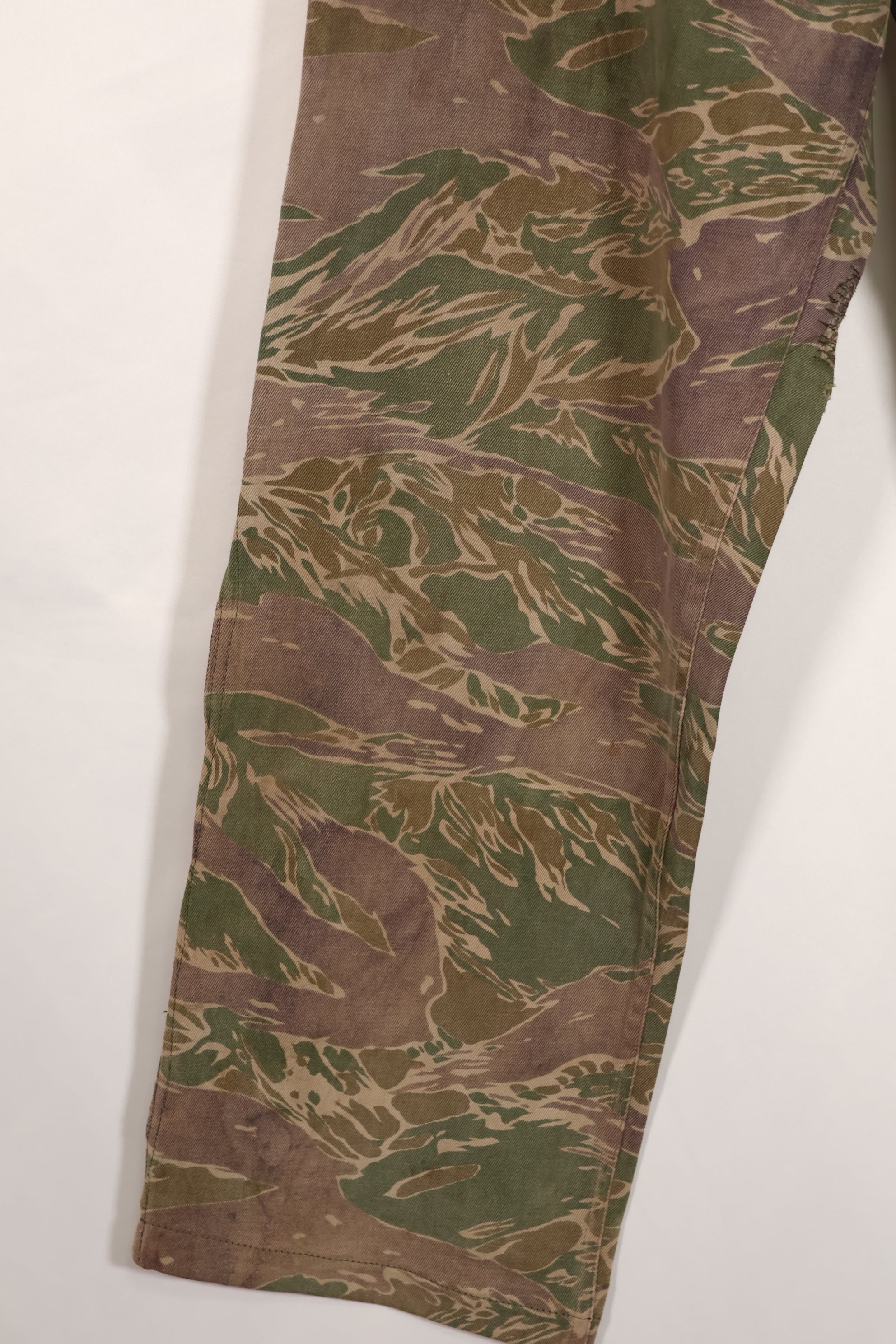 Real tiger stripe pants, silver tiger pattern, tanned, faded, used.