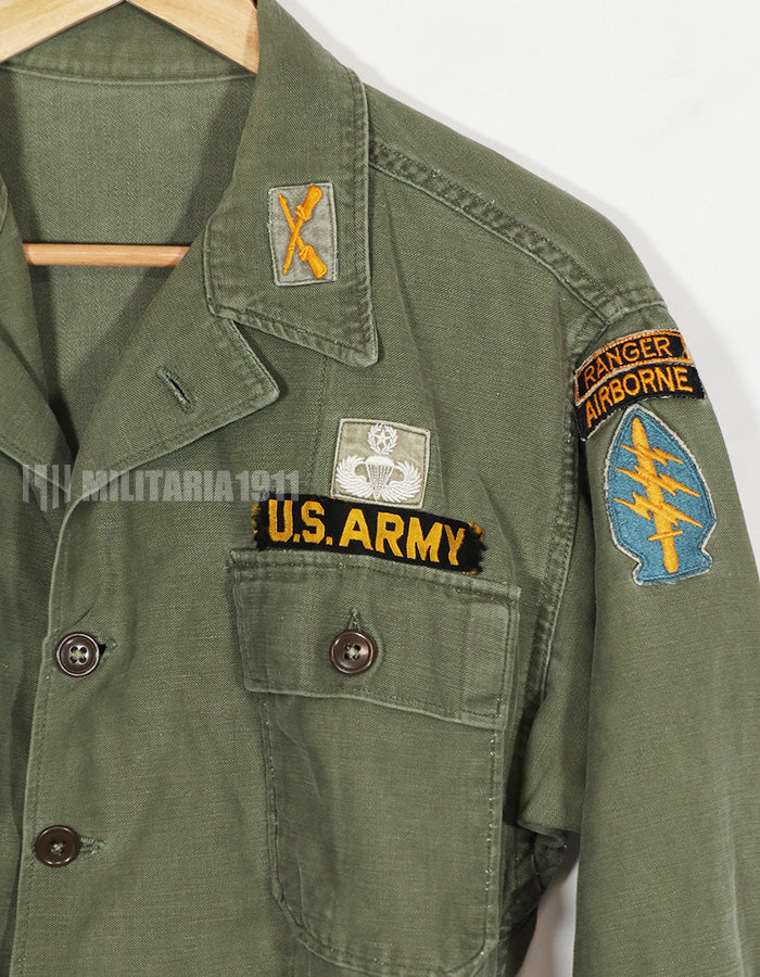 Real early OG-107 utility shirt with special forces patch, faded, used.