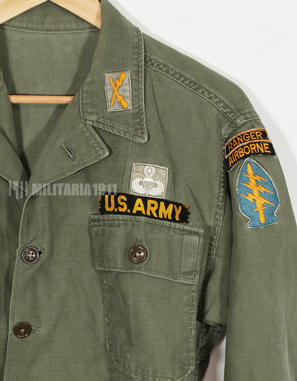 Real early OG-107 utility shirt with special forces patch, faded, used.